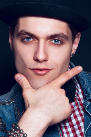 close up portrait of young caucasian man in studio on black backgroundの写真素材