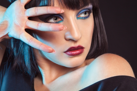 Cutie brunette in studio on black backgroundの写真素材
