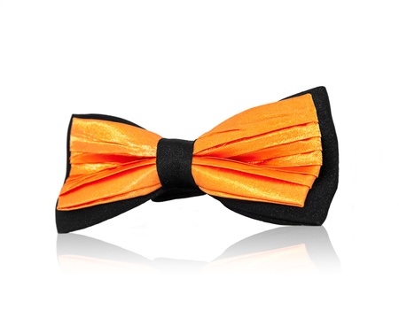 orange bowtie on white background in studioの写真素材