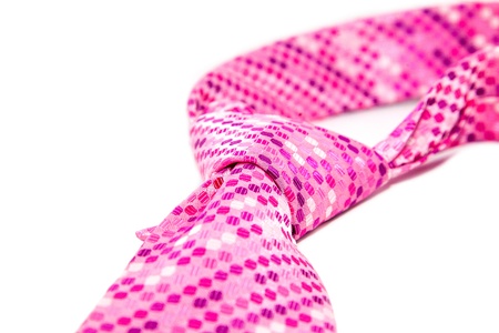 pink cravat flyspecked on white backgroundの写真素材