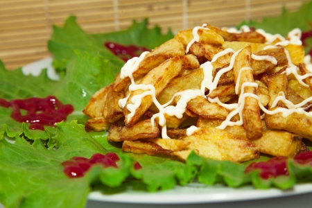 fries on a plate with lettuceの写真素材