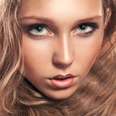 Young caucasian woman looking at camera in studioの写真素材