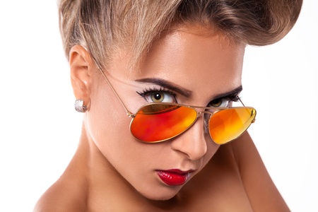 Gorgeous woman in sunglasses in studioの写真素材