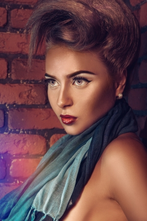 Portrait of caucasian female near brick wallの写真素材
