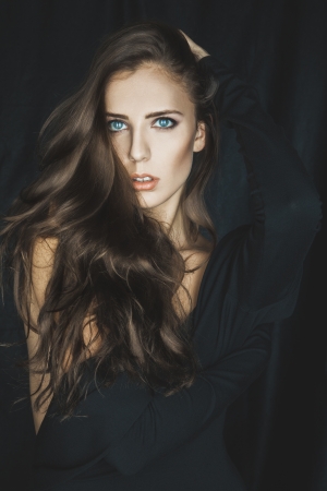 portrait of cutie adult female in studio on gray backgroundの写真素材