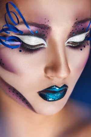 Close up portrait ofbeautiful caucasian woman with creative make up in studioの写真素材
