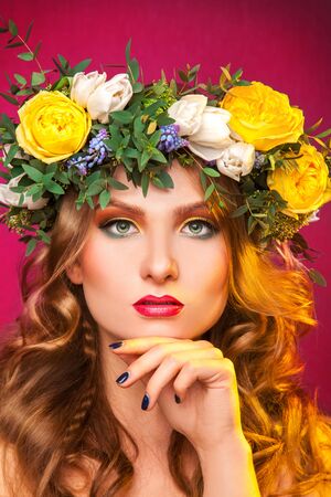 Gorgeous woman with wrerath on hair in studioの写真素材