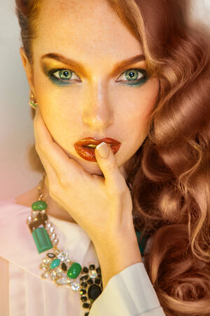 Bewitching woman with freckles on skin in studioの写真素材