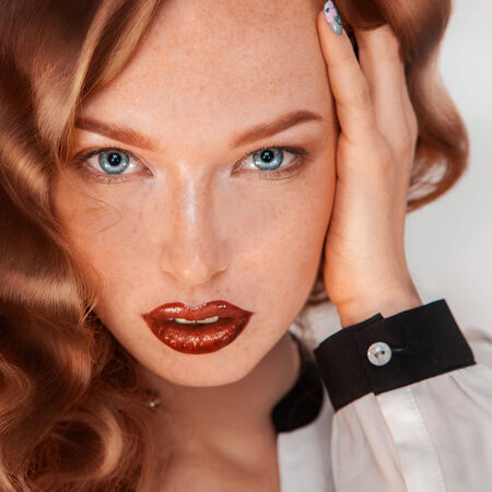 Square picture of fashion model with freckles in studioの写真素材
