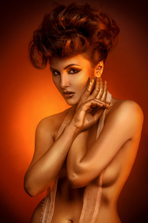 Portrait of sexual adult girl in bandage bra in studioの写真素材