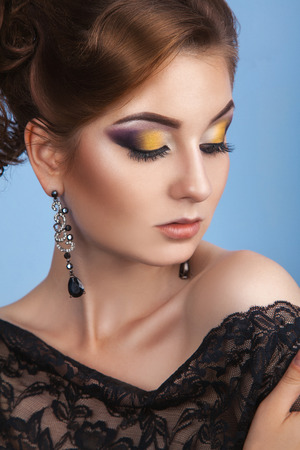 Sensual adult beautiful woman with closed eyes on blue の写真素材