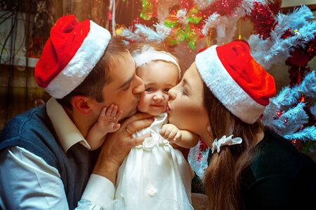 Family celebrating First christmas with little baby girl.の写真素材
