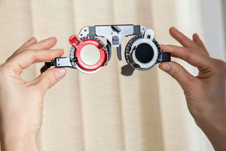 glasses for checking and correcting the vision in the hands of doctorの写真素材