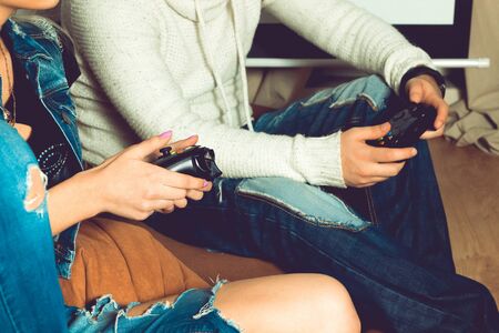 Photo of hands of woman and man with joystick. concept of leisure entertainment and fun