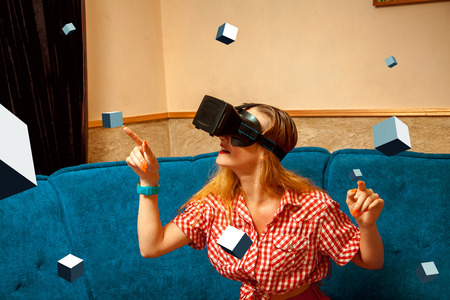 close up portrait of Cheerful young woman in virtual reality glasses smiling. VR helmet. third...