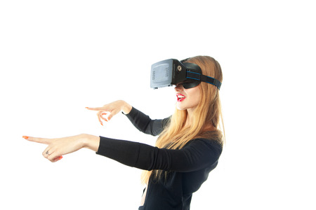 cutie woman in virtual reality helmet isolated on white background . Third dimension. Virtual...
