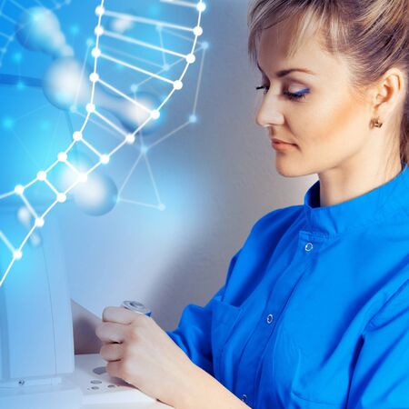 young beautiful girl doctor in the course of work with holographic future computers....
