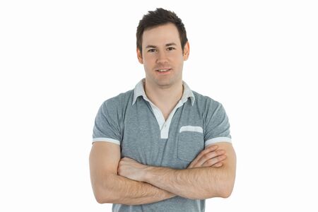 Young man in grey t-shirt is crossing his handsの写真素材