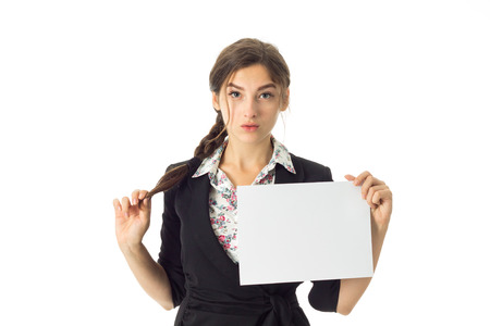 young adorable brunette business woman in uniform with white placard in hands isolated on white backgroundの写真素材