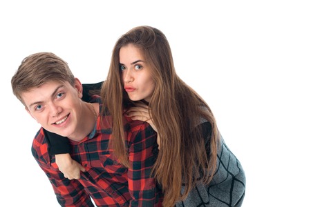 close up of attractive stylish couple in love having fun in studio isolated on white backgroundの写真素材