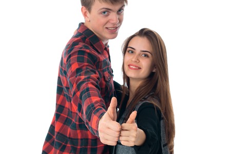 close up portrait of happy young stylish couple in love having fun in studio isolated on white backgroundの写真素材