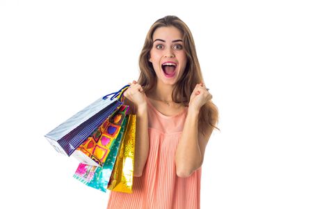 young girl keeps packages in hand and rejoices closeupの写真素材