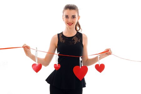 portrait of cheerful brunette in love with red heart isolated on white . saint valentines concept....