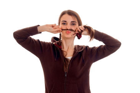 portrait of young funny student girl in brown sport clothes isolated on white