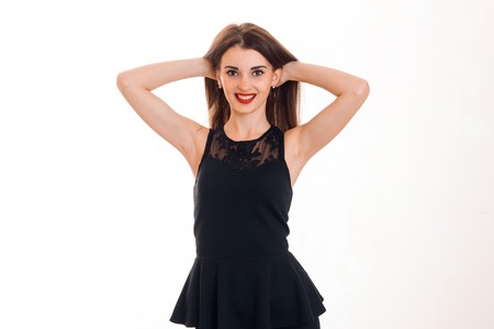 Cheerful brunette lady with red lips smiling on camera isolated on white