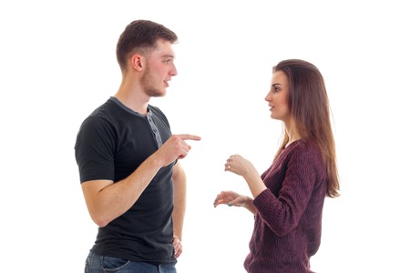 young beautiful guy and girl stand opposite each other and discover something isolated on white...