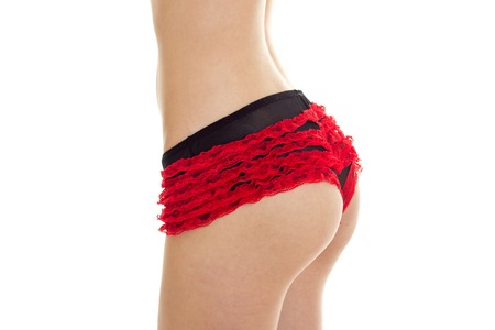 sexy big womens buttocks in red lace panties close-up isolated on white backgroundの写真素材