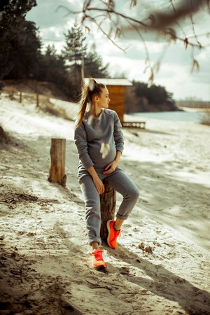 Cutire young pregnant blonde girlの写真素材