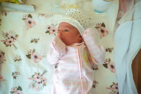Portrait of a cute newborn baby girl