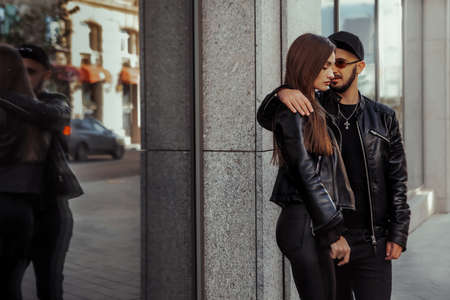 cheerful couple walks in the streetの写真素材