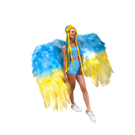 Beautiful woman in Blue and yellow wreath and wings. Pray for Ukraineの写真素材