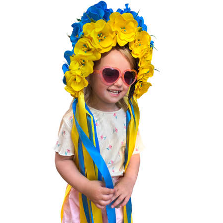 Happy girl posing on camera with blue and yellow wreast isolated on white background. Pray for Urkaine.の写真素材