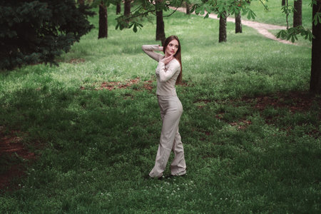 horizontal portrait of Beautiful girl in green forestの写真素材