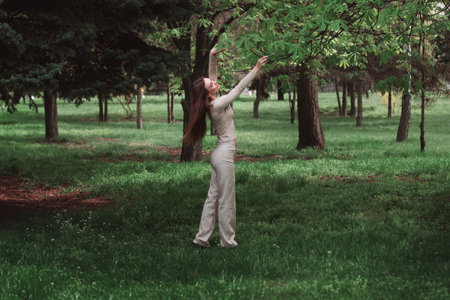 horizontal portrait of Beautiful girl in green forestの写真素材