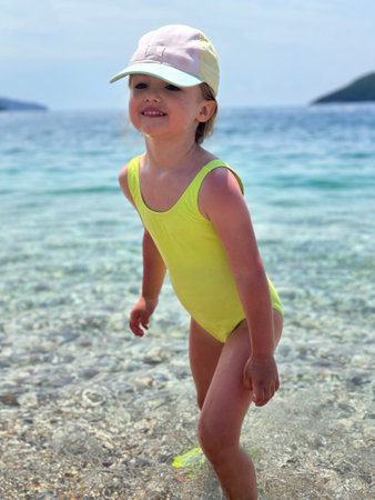 portrait of Adorable little girl at the beach during summer vacationの写真素材