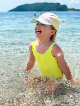 portrait of Adorable little girl at the beach during summer vacationの写真素材