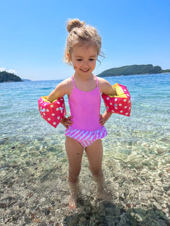 portrait of Adorable little girl at the beach during summer vacationの写真素材