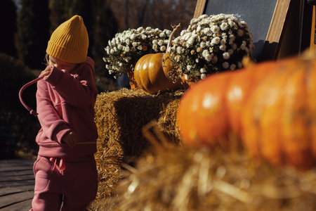 autumn mood little girl portrait outdoorsの写真素材