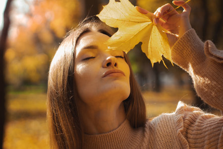 fall mood beautiful woman portrait outdoorsの写真素材