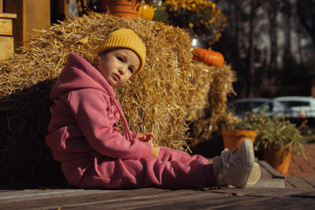 autumn mood little girl portrait outdoorsの写真素材