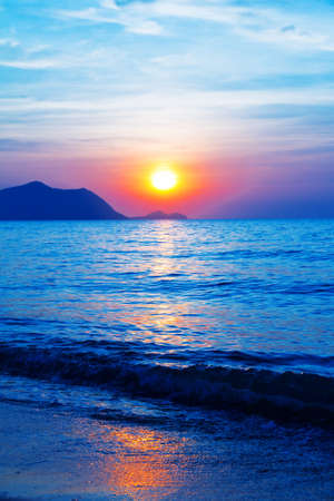 Beautiful sunset on the beach の写真素材