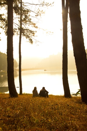 Sweet couple in love along the lake,In a romantic atmosphere.の写真素材