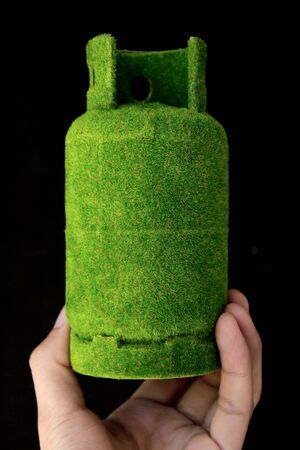 Hand holding eco gas tank ,save energy concept 