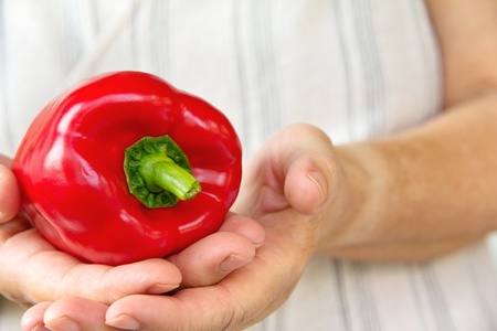 hand holding sweet pepper