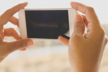 Woman Using a Smart Phoneの写真素材