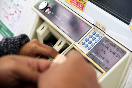 People buy tickets for at Ueno train station in Tokyo. の写真素材